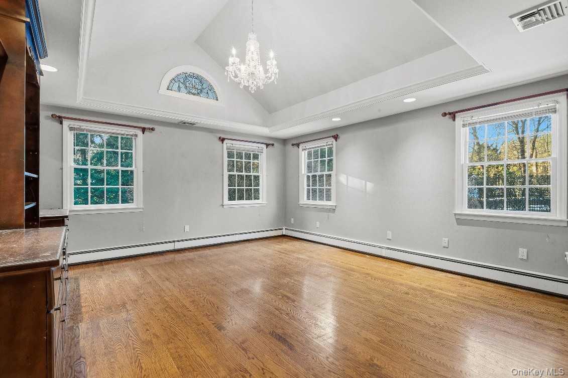 51 Bay Road Huntington Bay, NY 11743 - Photo 25 of 42 a view of an empty room with a window and wooden floor