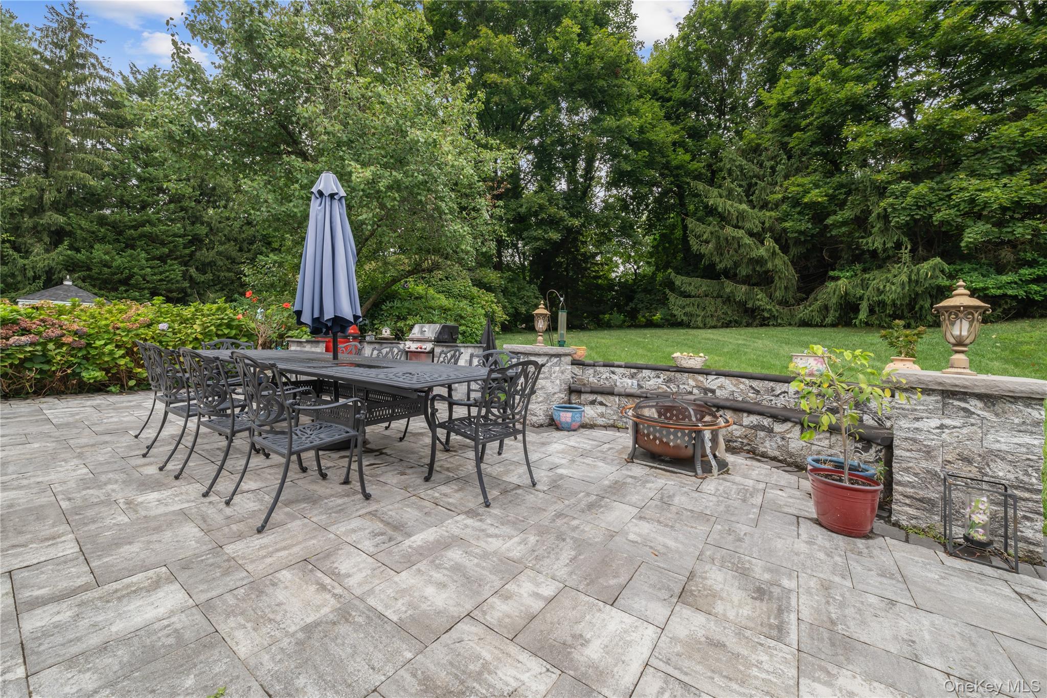 51 Bay Road Huntington Bay, NY 11743 - Photo 27 of 42 a view of a dining tables and chairs in the patio