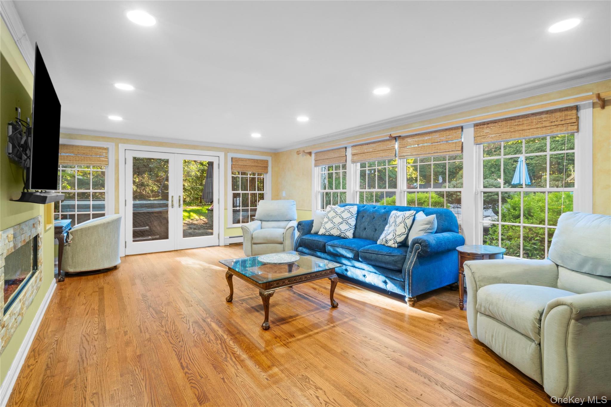 51 Bay Road Huntington Bay, NY 11743 - Photo 7 of 42 a living room with furniture and a flat screen tv