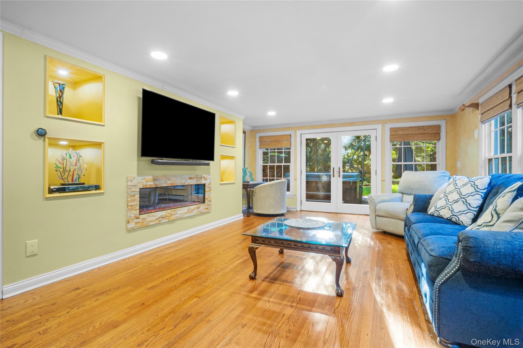51 Bay Road Huntington Bay, NY 11743 - Photo 8 of 42 a living room with furniture and a flat screen tv