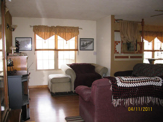 2294 Drexel Road Davis, IL 61019 - Photo 3 of 11 a living room with furniture a window and a flat screen tv