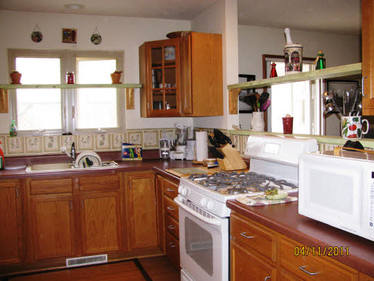 2294 Drexel Road Davis, IL 61019 - Photo 5 of 11 a kitchen with sink a window and cabinets