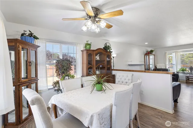 a dining room with furniture and window