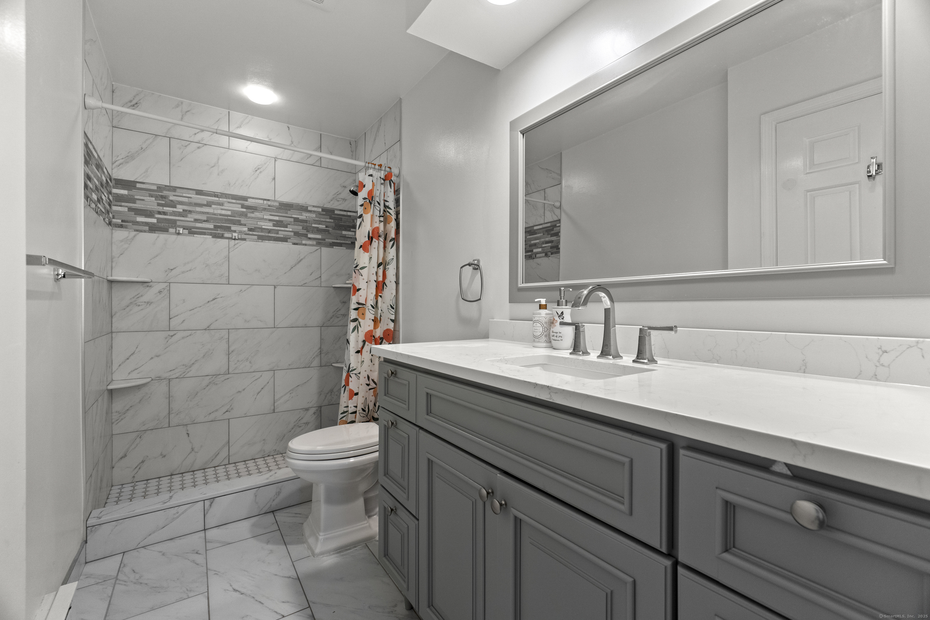 8 Rose Lane, Unit 105 Danbury, CT 06811 - Photo 12 of 20 a bathroom with a sink toilet and shower