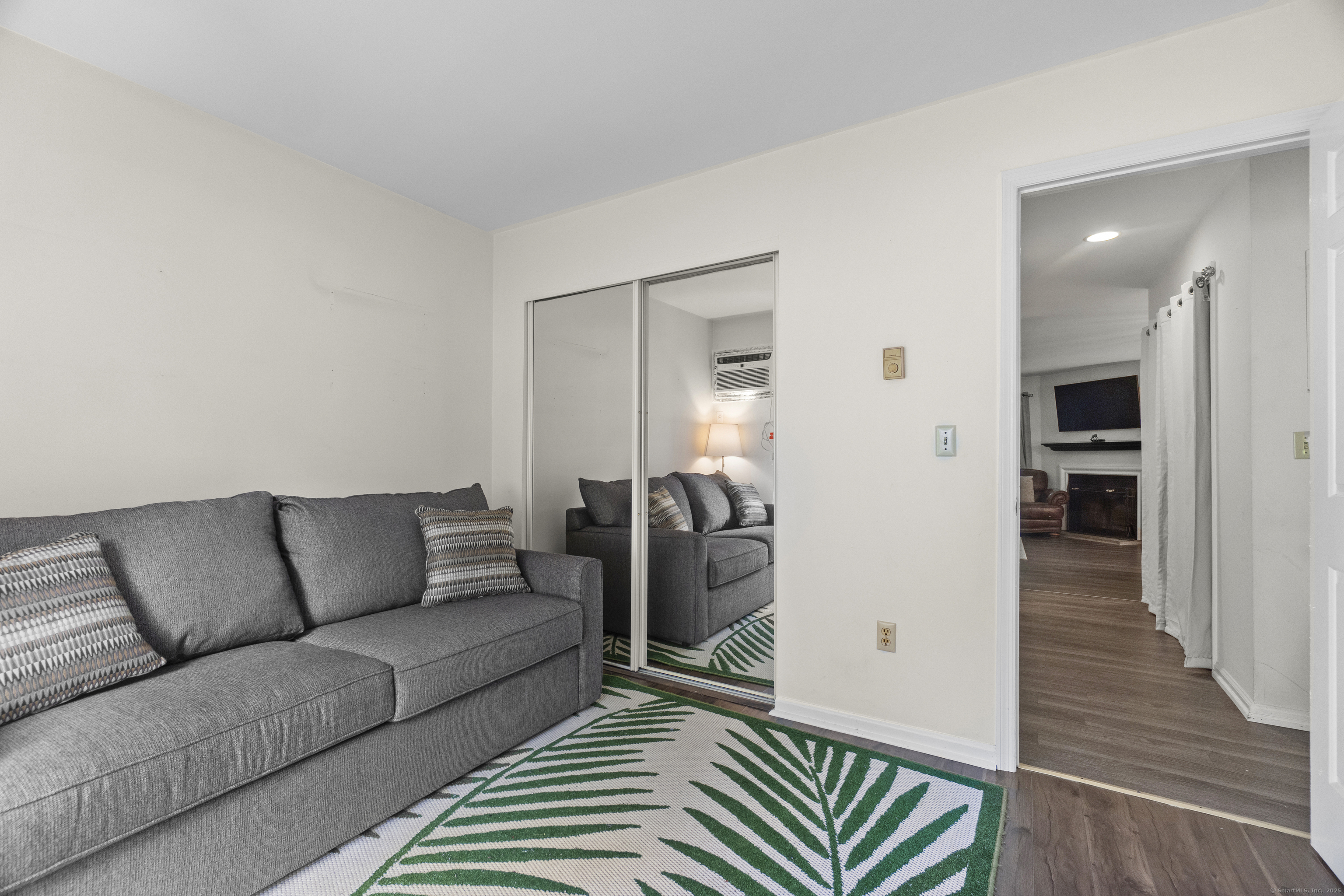 8 Rose Lane, Unit 105 Danbury, CT 06811 - Photo 13 of 20 a living room with furniture and wooden floor