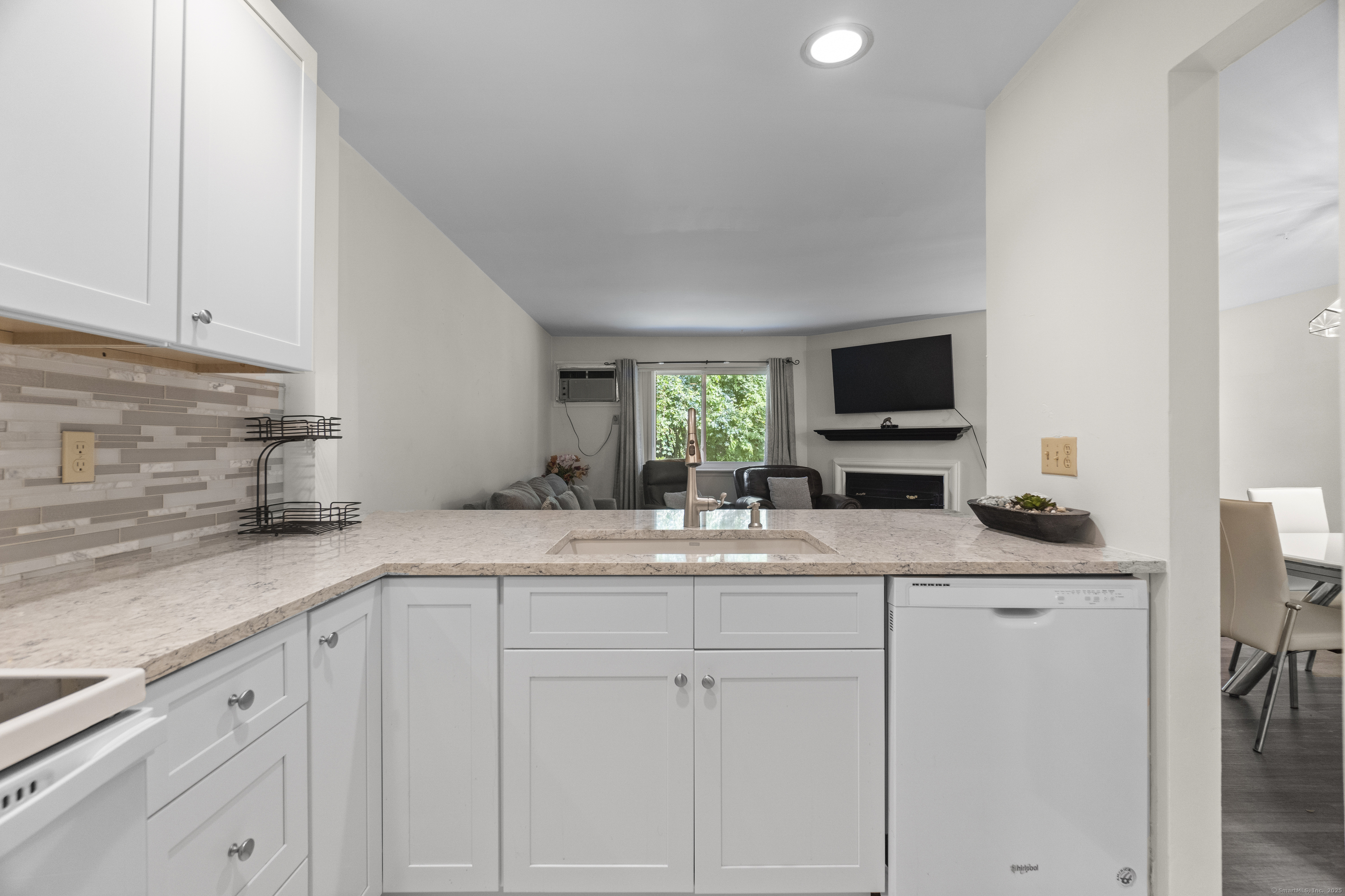 8 Rose Lane, Unit 105 Danbury, CT 06811 - Photo 8 of 20 a kitchen with cabinets appliances and a sink