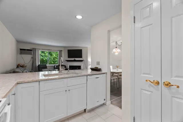 a kitchen with cabinets and window