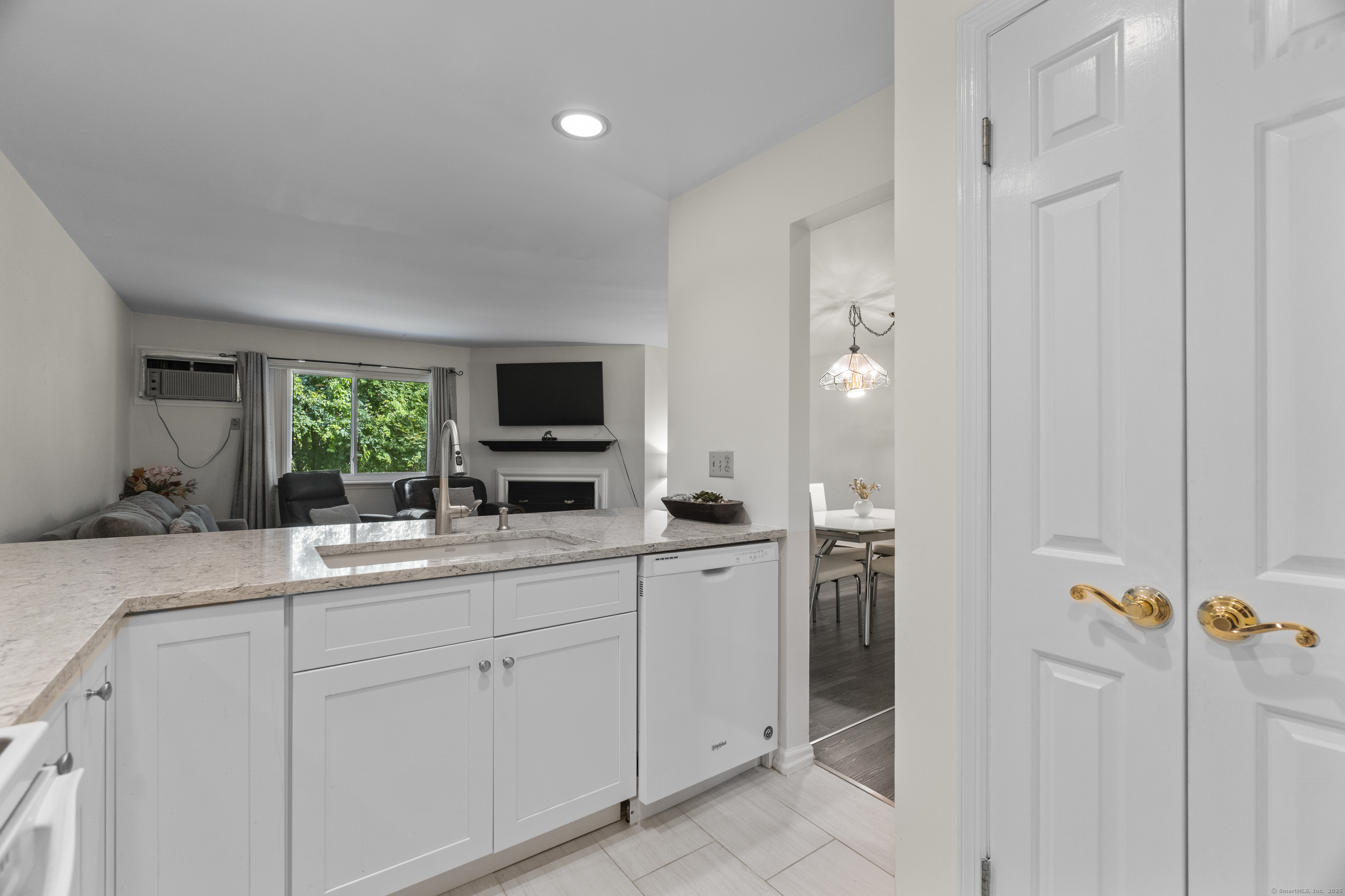 8 Rose Lane, Unit 105 Danbury, CT 06811 - Photo 9 of 20 a kitchen with cabinets and window