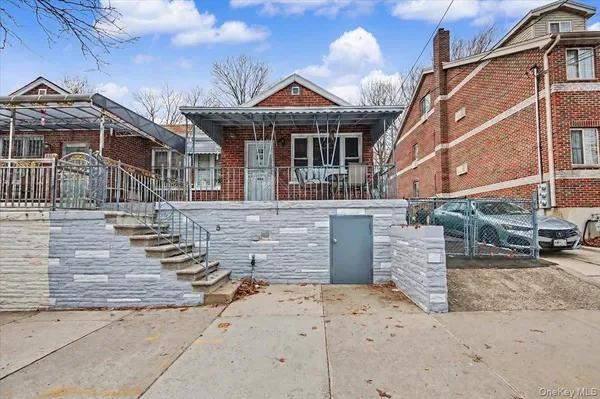 a front view of a house with a wooden fence