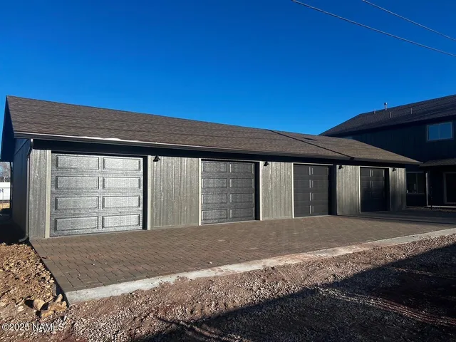 a view of backyard with large tree
