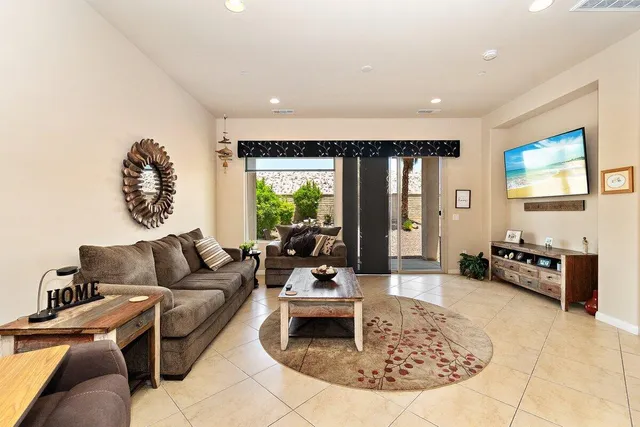 a living room with furniture and a large window