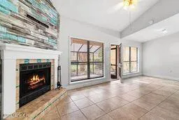 a view of an empty room with a fireplace