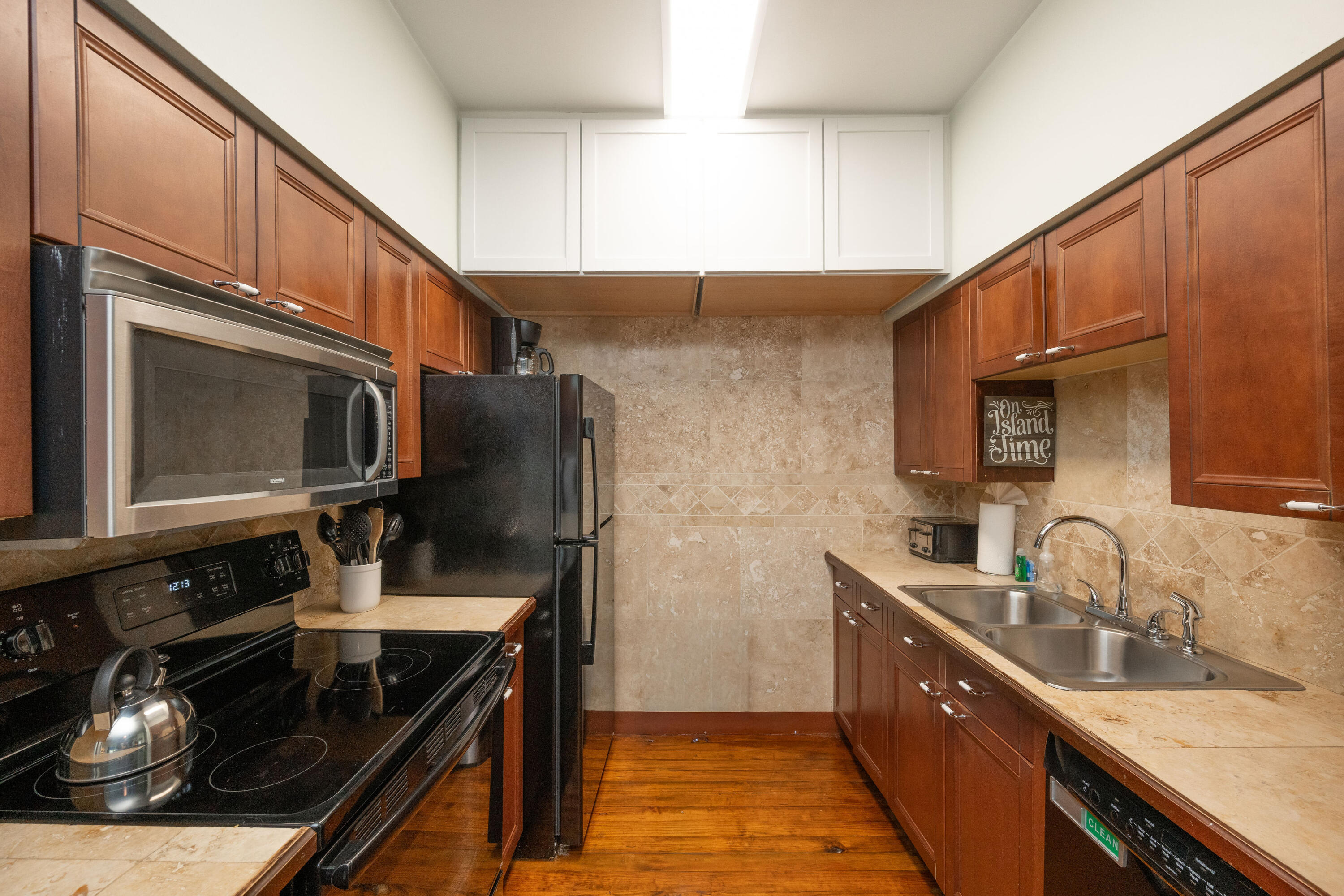 906 Truman Avenue, Unit 2 Key West, FL 33040 - Photo 20 of 33 a kitchen with stainless steel appliances granite countertop a sink stove and refrigerator