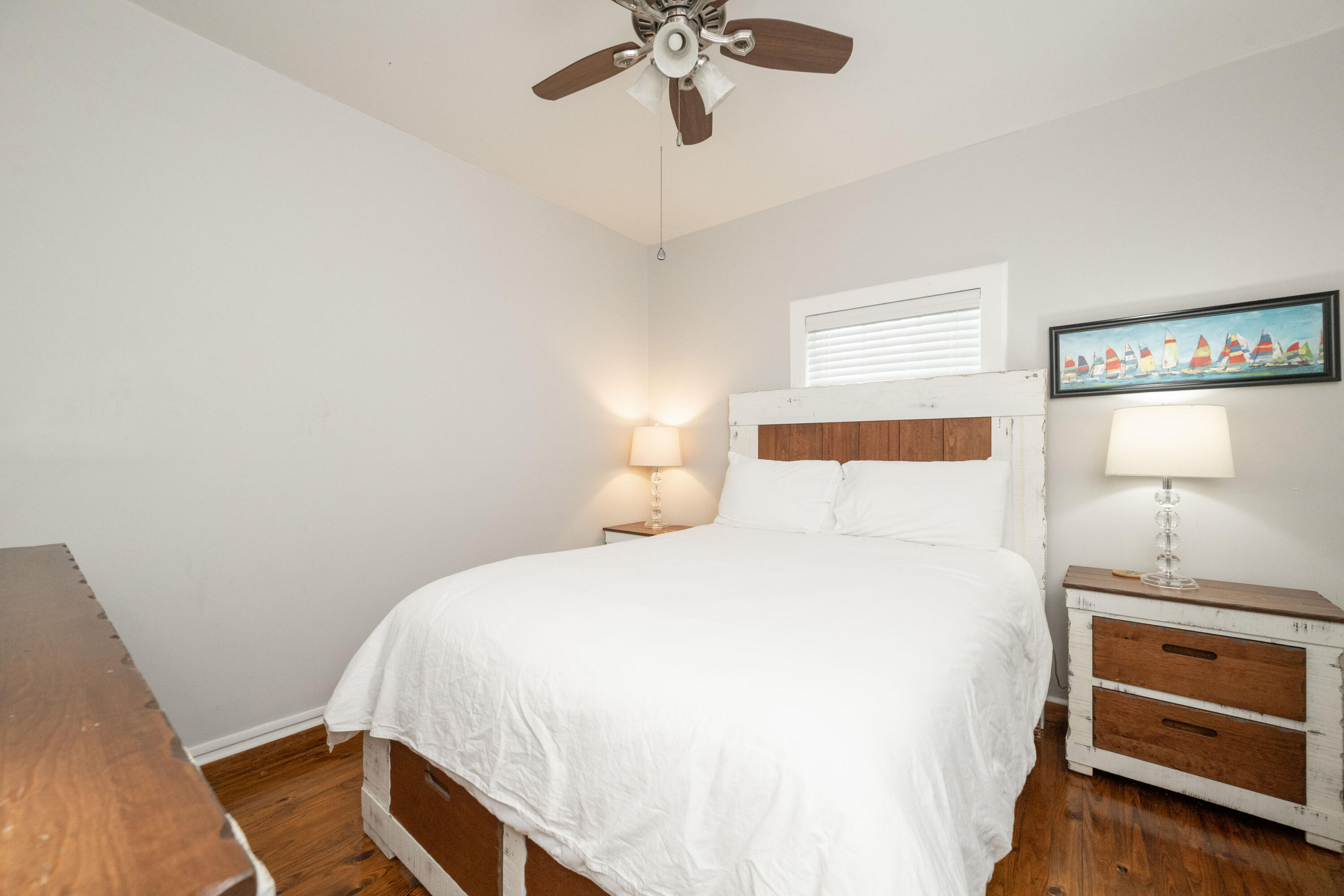 906 Truman Avenue, Unit 2 Key West, FL 33040 - Photo 24 of 33 a bedroom with a bed and a ceiling fan