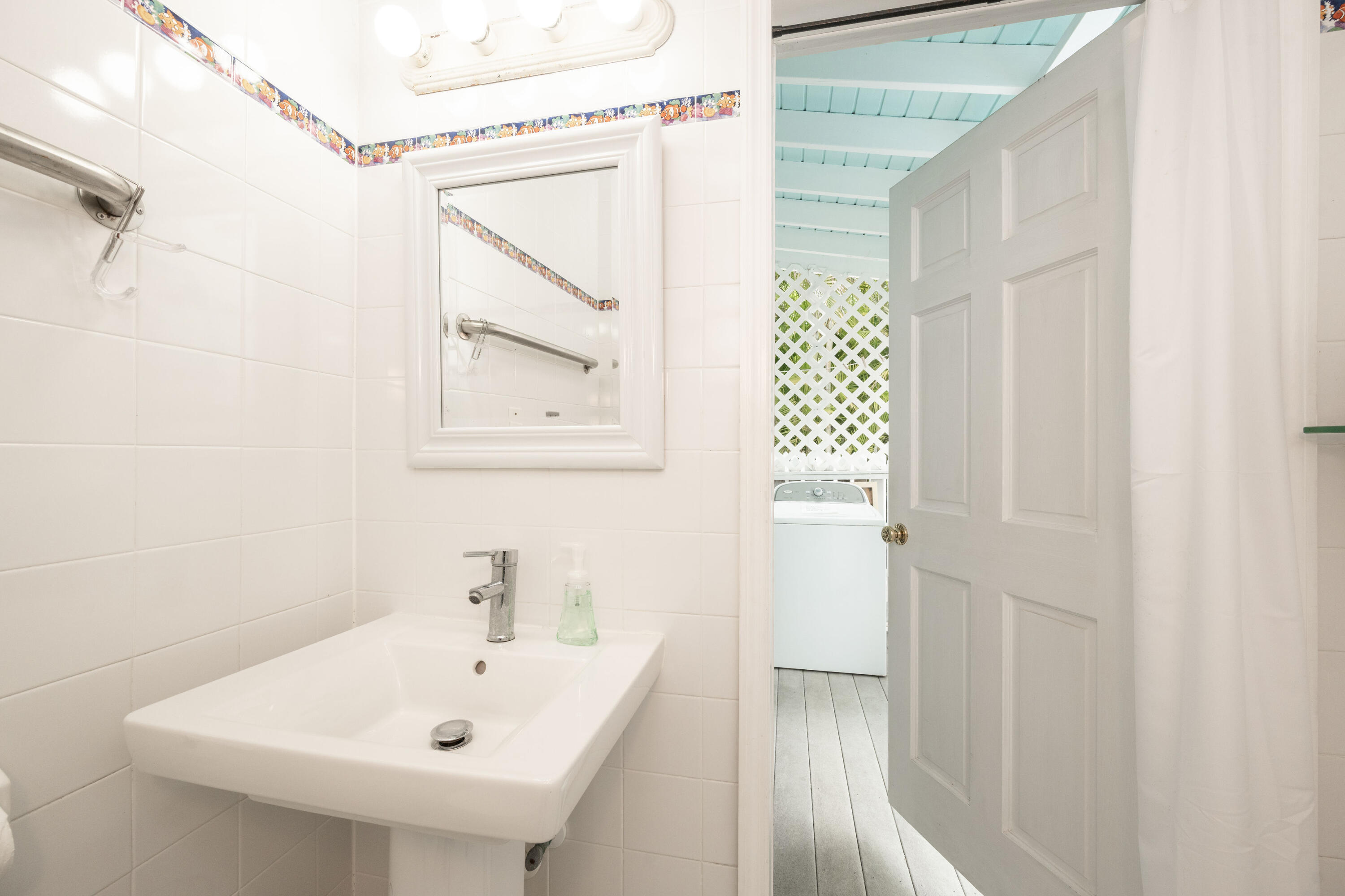 906 Truman Avenue, Unit 2 Key West, FL 33040 - Photo 29 of 33 a bathroom with a sink a window and shower