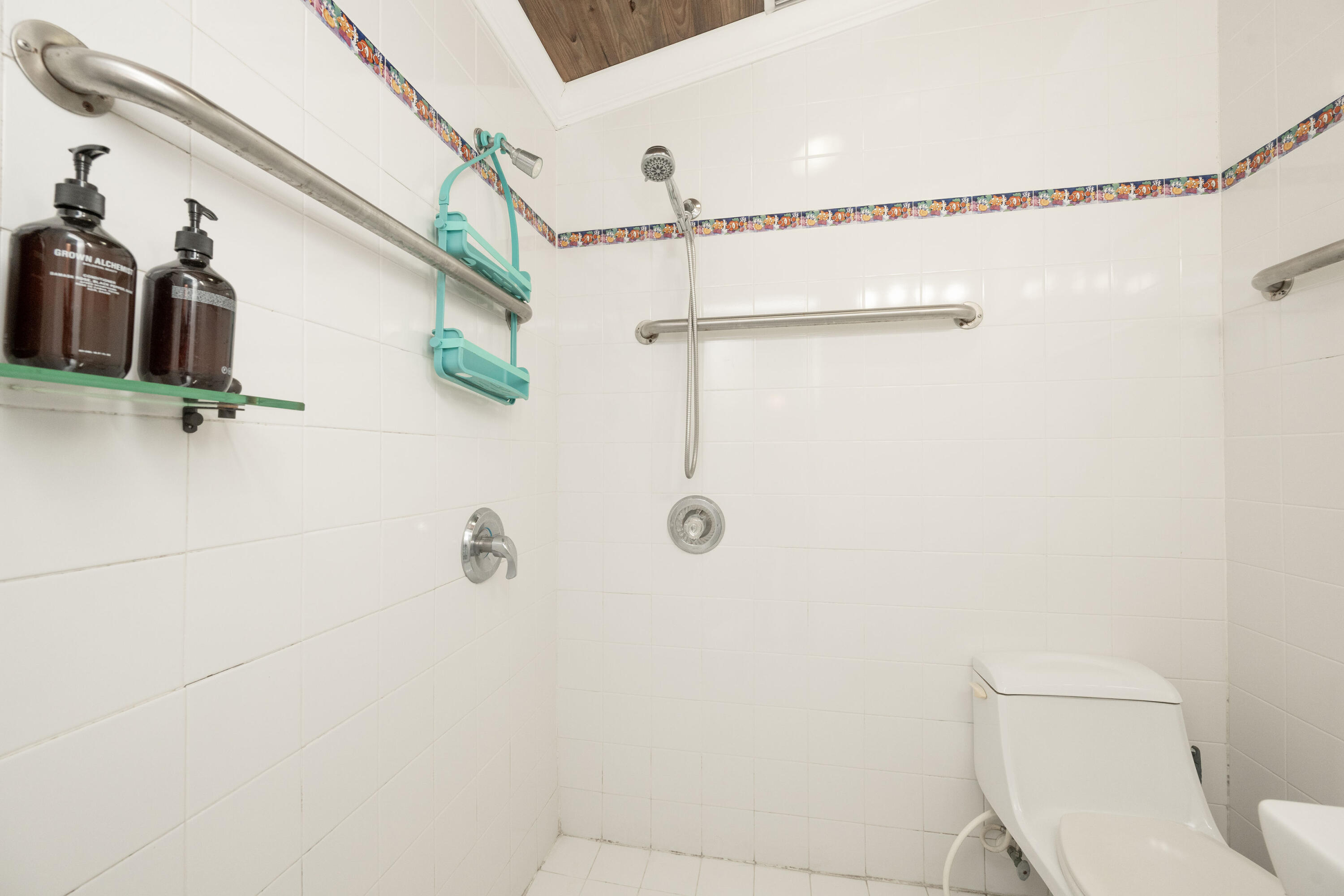 906 Truman Avenue, Unit 2 Key West, FL 33040 - Photo 30 of 33 a bathroom with a shower and toilet