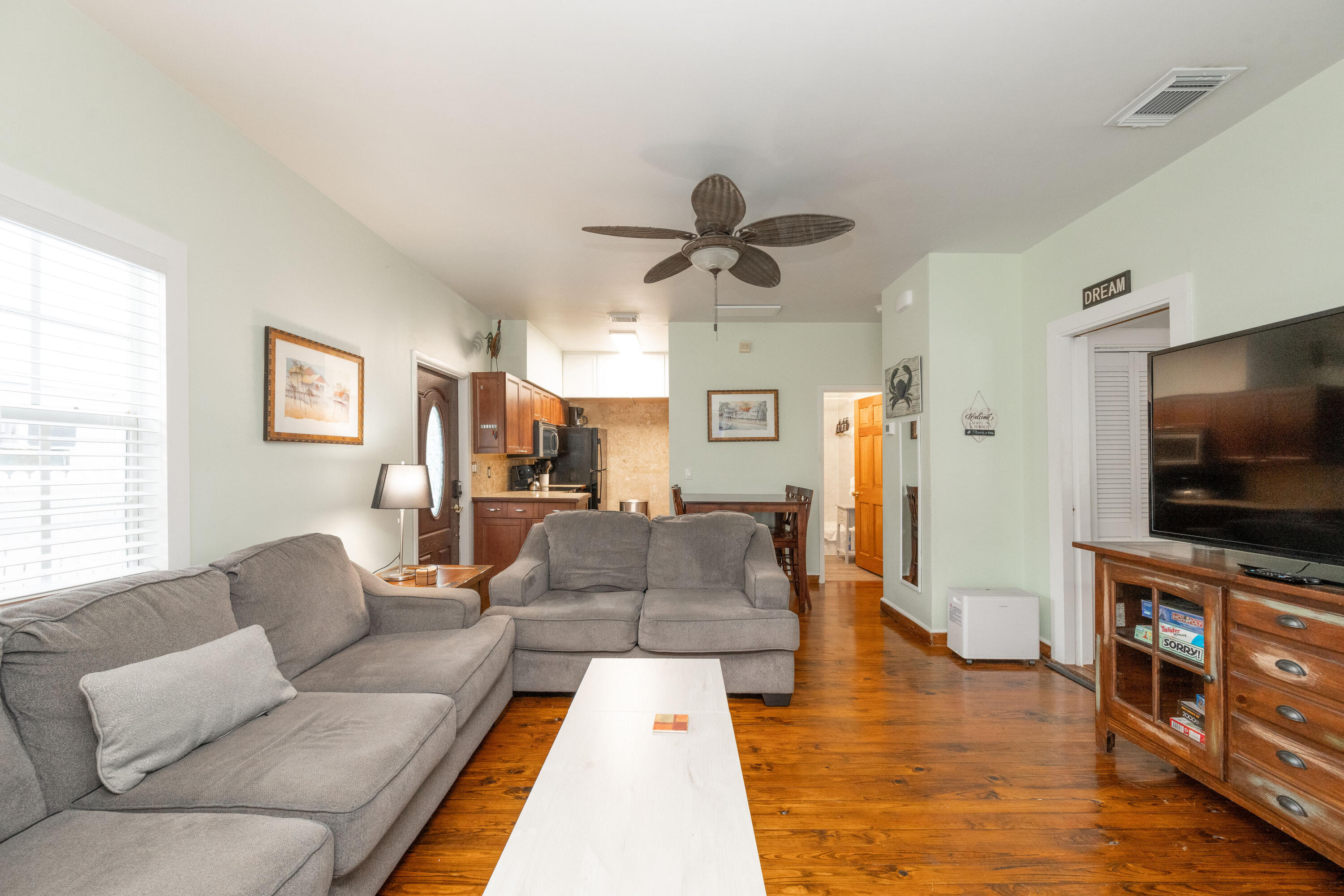 906 Truman Avenue, Unit 2 Key West, FL 33040 - Photo 6 of 33 a living room with furniture and a flat screen tv