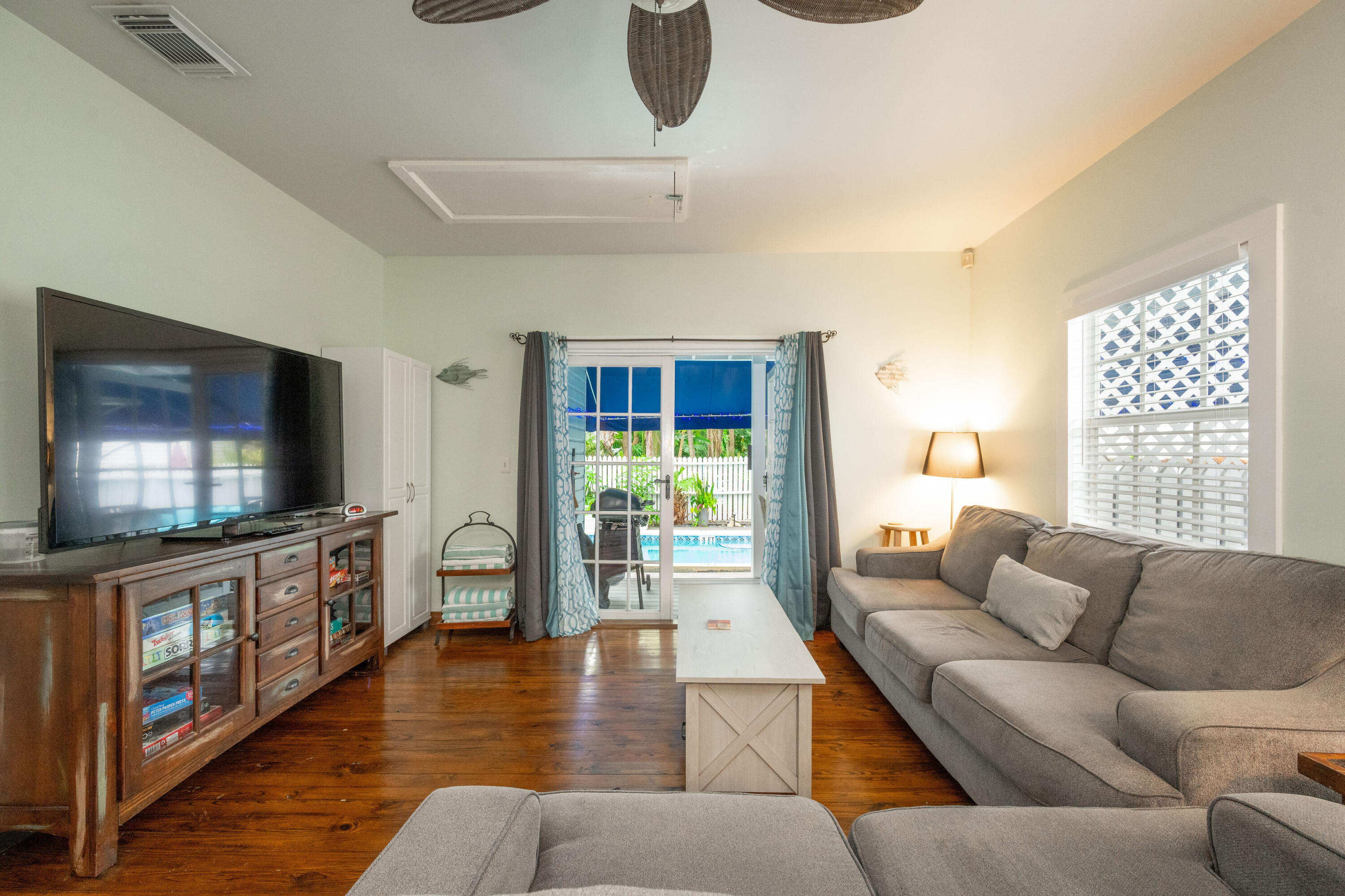 906 Truman Avenue, Unit 2 Key West, FL 33040 - Photo 8 of 33 a living room with furniture and a flat screen tv