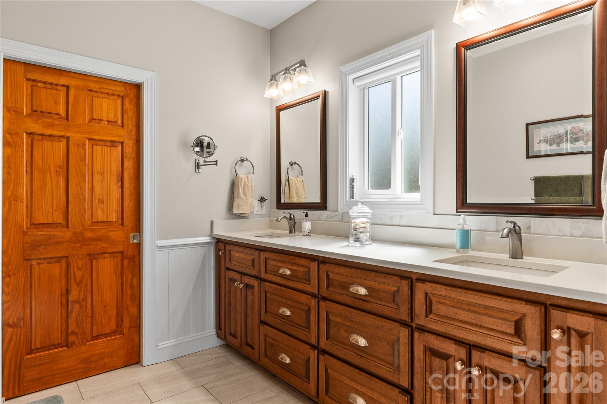 1103 River Ridge Way Lenoir, NC 28645 - Photo 17 of 46 a bathroom with a double vanity sink and a mirror