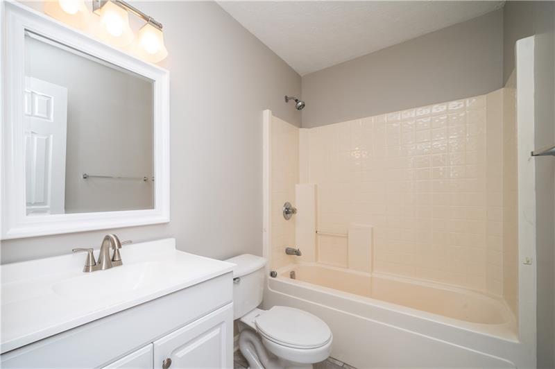 7 Wellington Court McKees Rocks, PA 15136 - Photo 17 of 25 Hall bath. Look at that pretty new vanity, mirror & light fixture!
