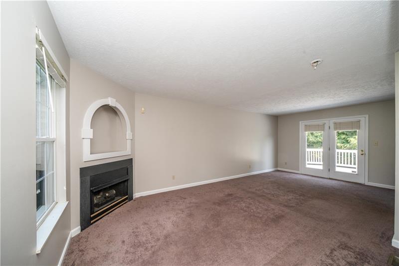 7 Wellington Court McKees Rocks, PA 15136 - Photo 4 of 25 Large family room with fireplace gives you space to relax.