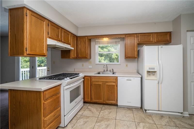 7 Wellington Court McKees Rocks, PA 15136 - Photo 7 of 25 Easy meal prep with generous counter & cabinet space.