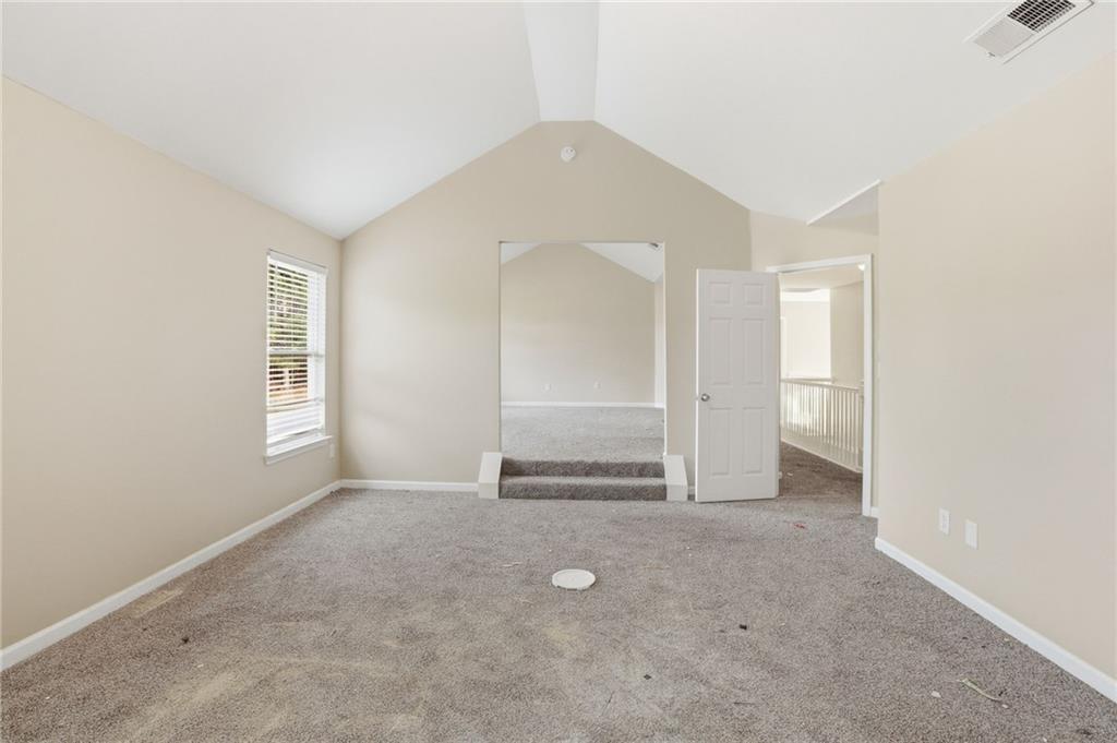 4968 Locherby Drive Fairburn, GA 30213 - Photo 23 of 39 an empty room with windows and closet