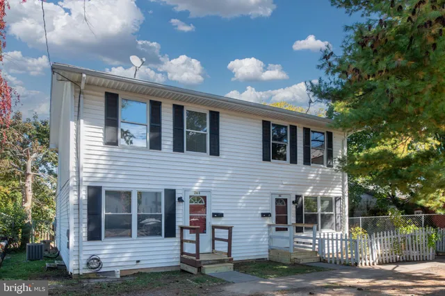 a front view of a house with a yard from a balcony