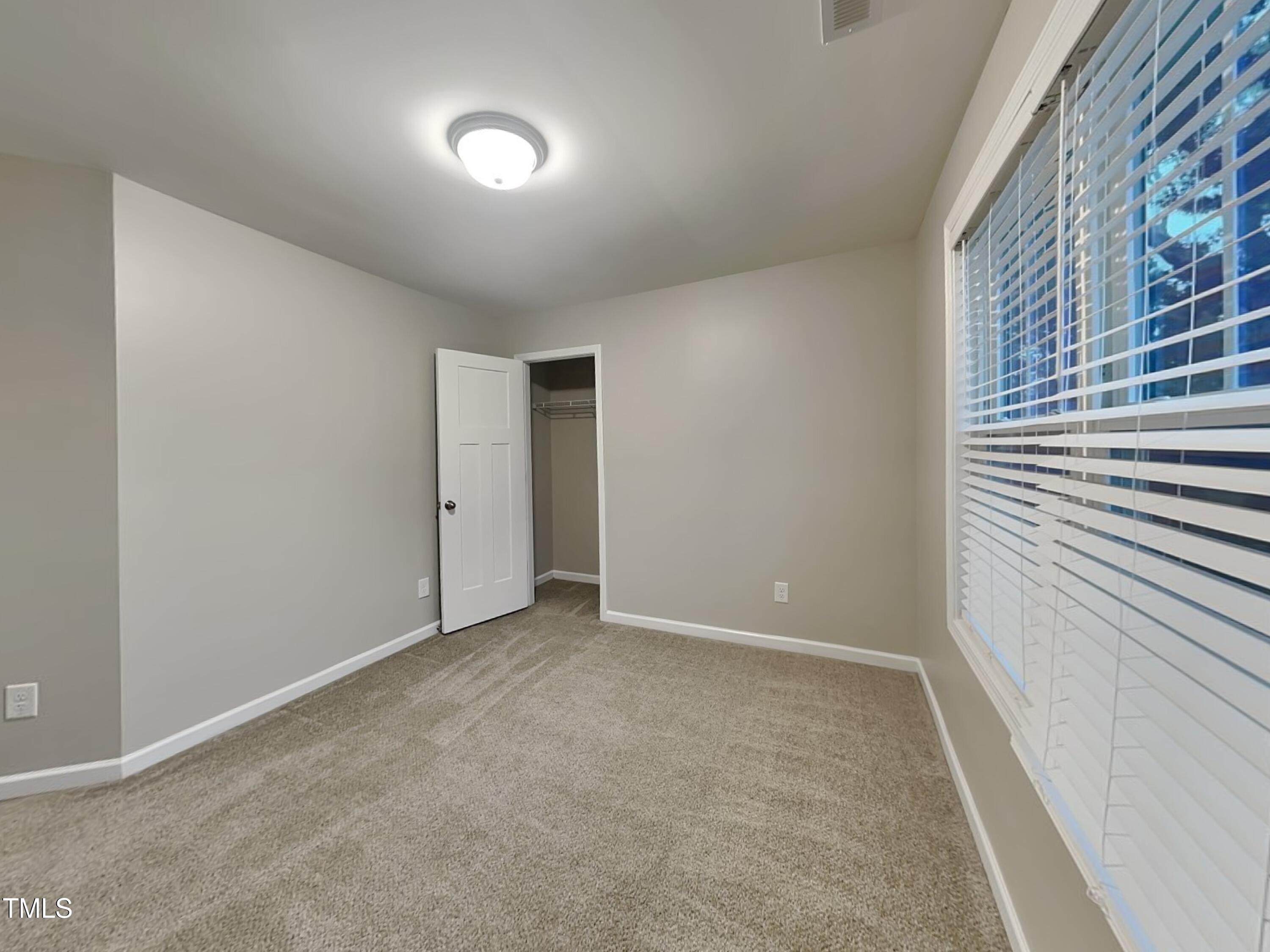 877 Juno Drive Broadway, NC 27505 - Photo 13 of 22 a view of an empty room with a window