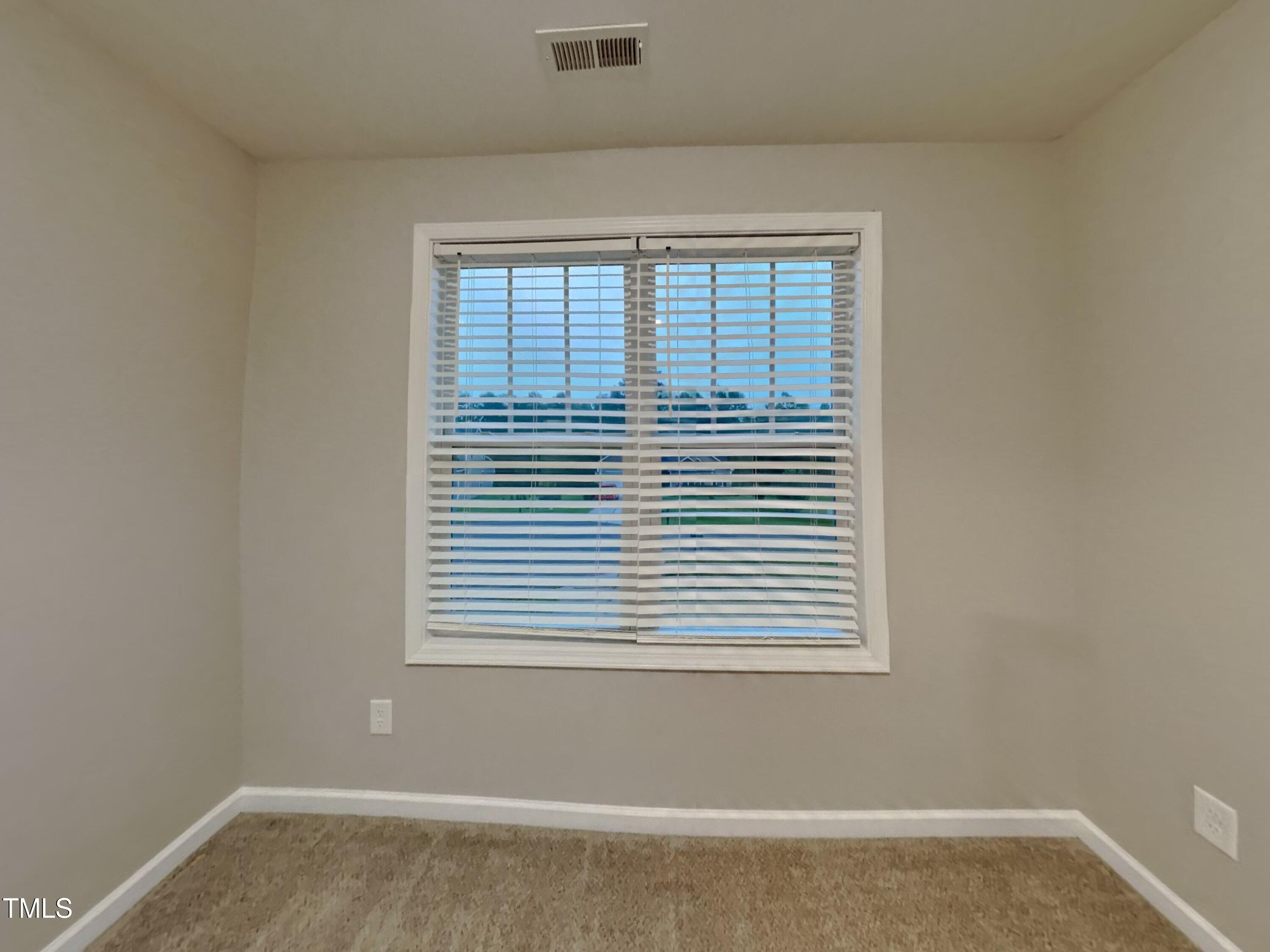 877 Juno Drive Broadway, NC 27505 - Photo 14 of 22 a view of a small space with a window