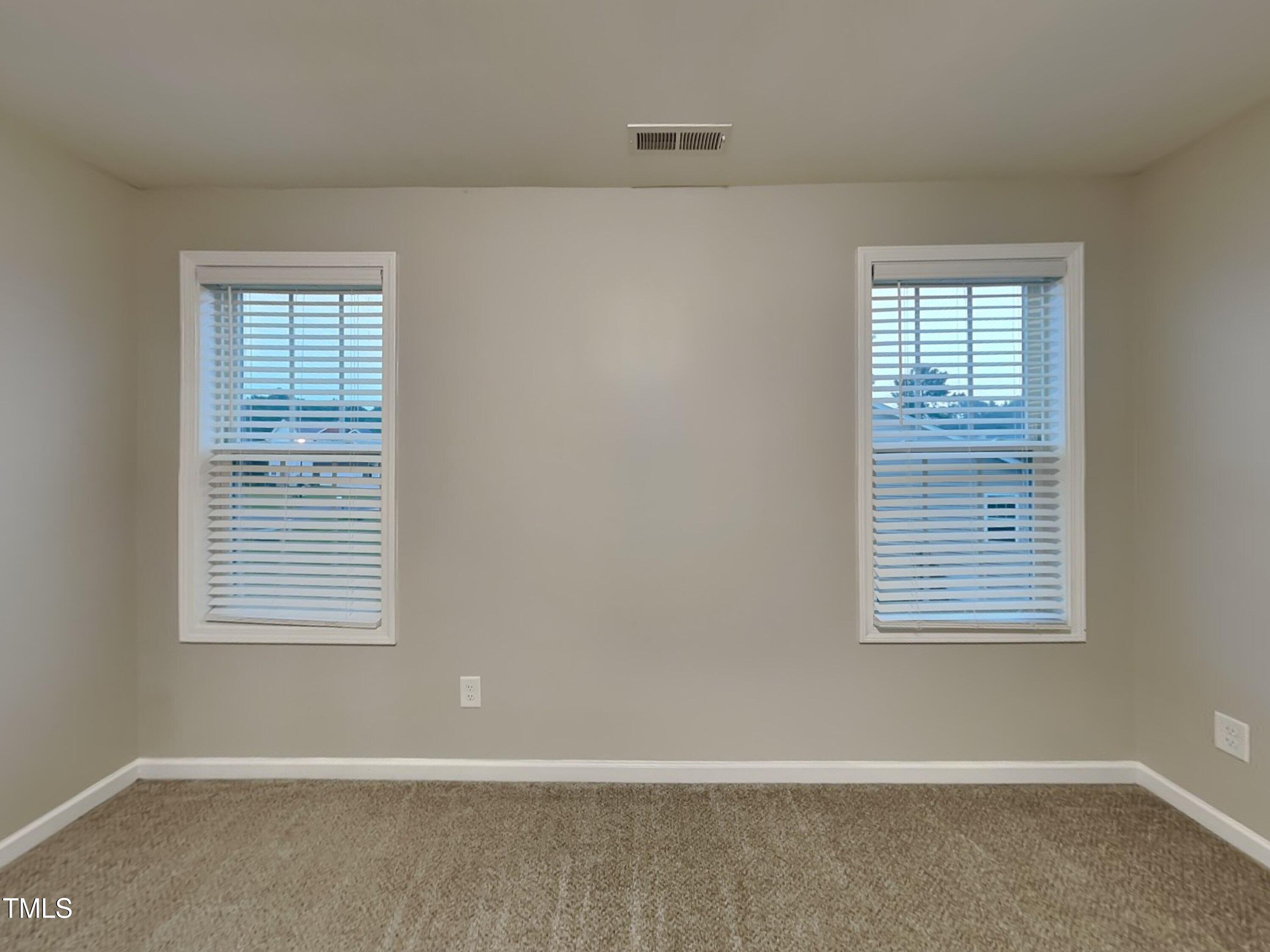 877 Juno Drive Broadway, NC 27505 - Photo 16 of 22 an empty room with a window