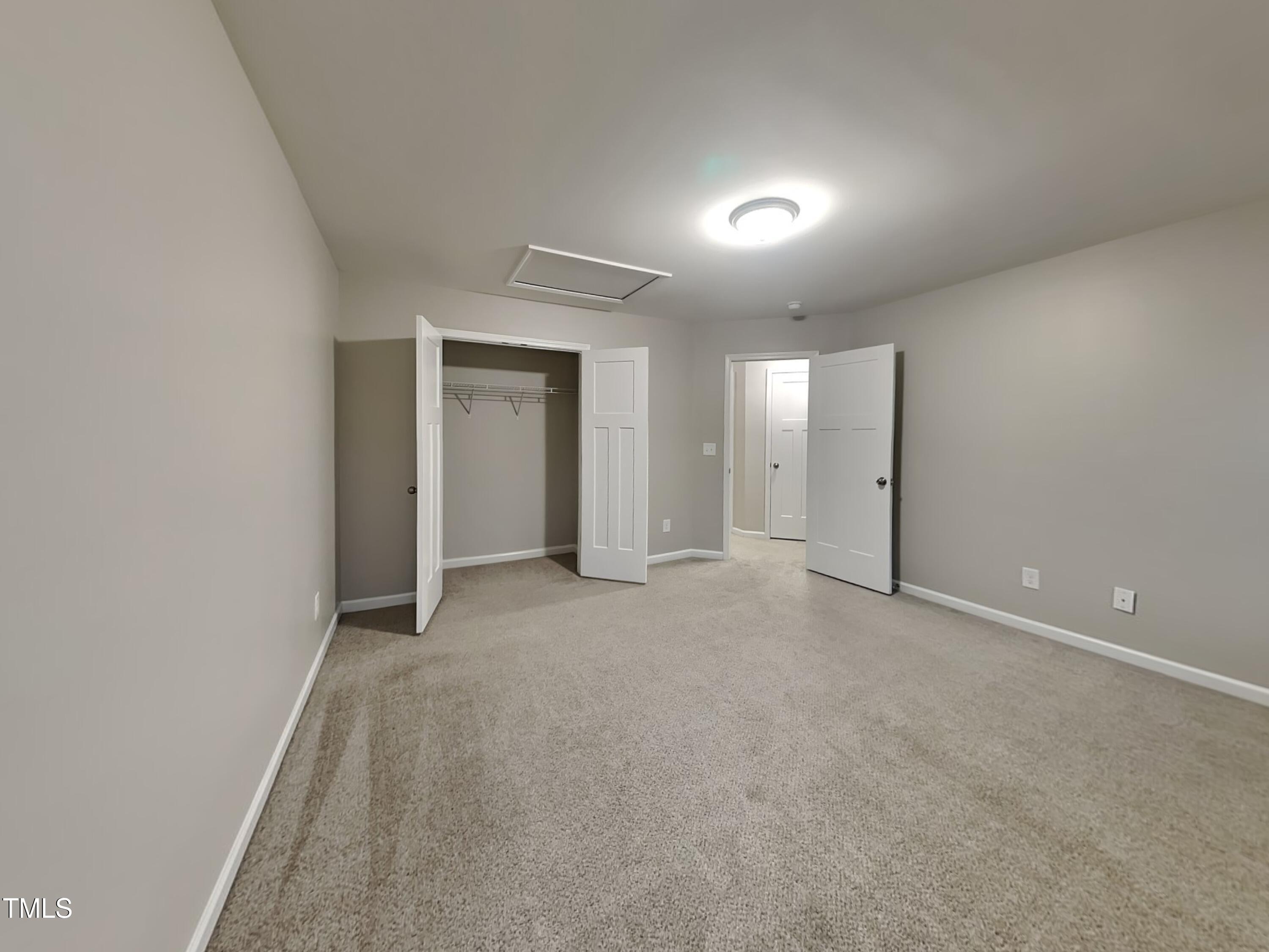 877 Juno Drive Broadway, NC 27505 - Photo 18 of 22 a view of an empty room and closet area