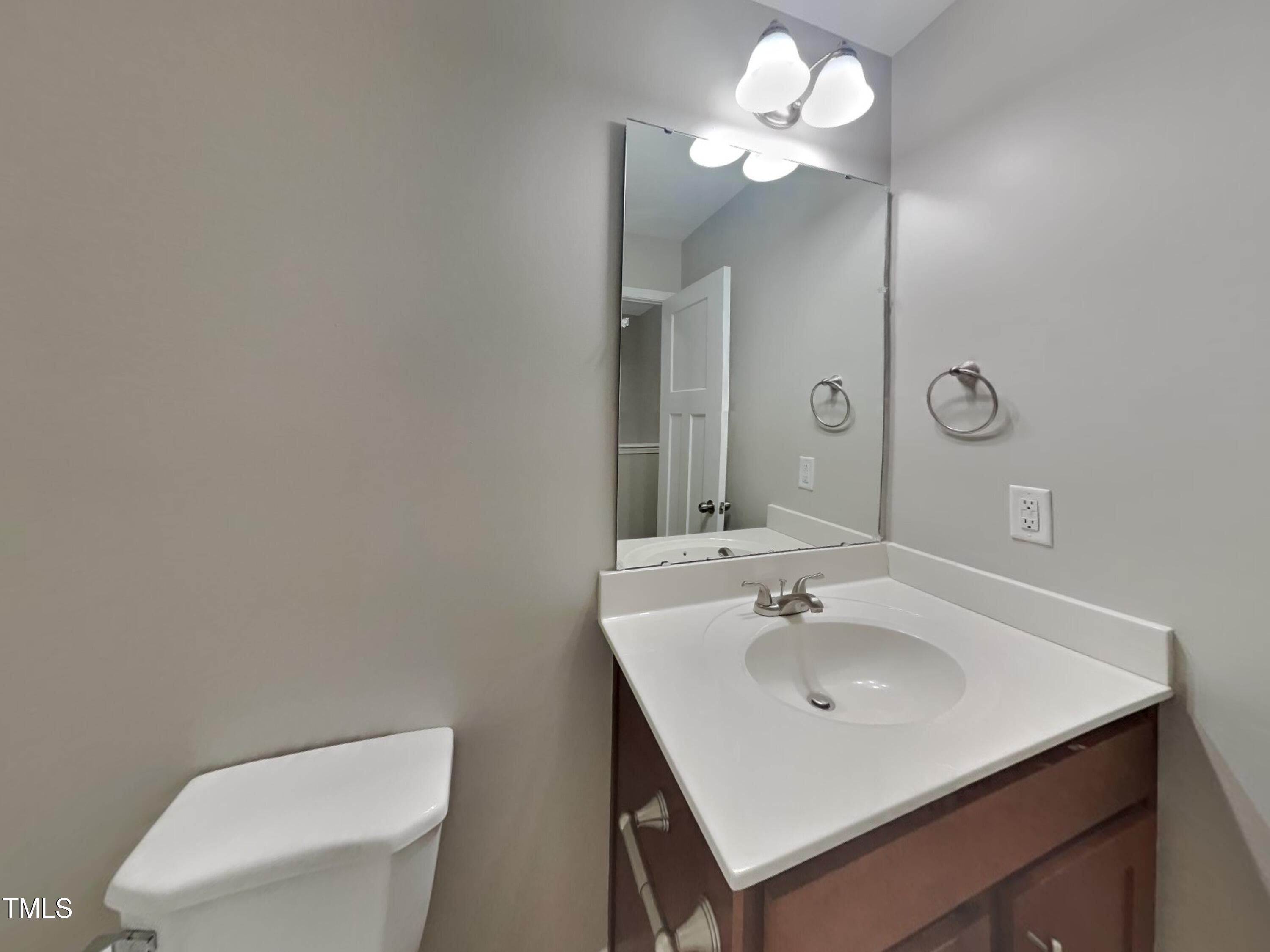 877 Juno Drive Broadway, NC 27505 - Photo 20 of 22 a bathroom with a sink vanity and a toilet