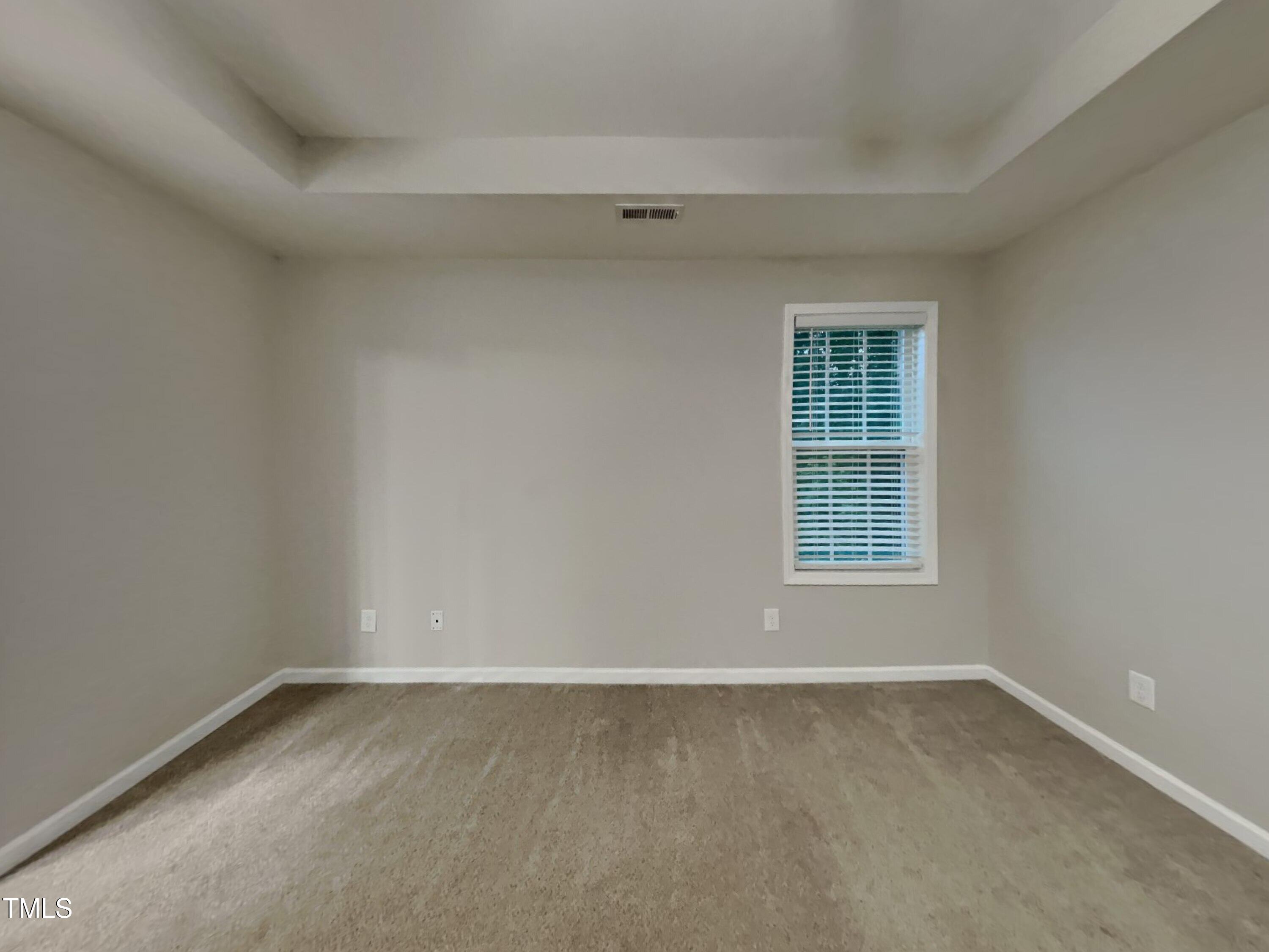 877 Juno Drive Broadway, NC 27505 - Photo 7 of 22 an empty room with a window