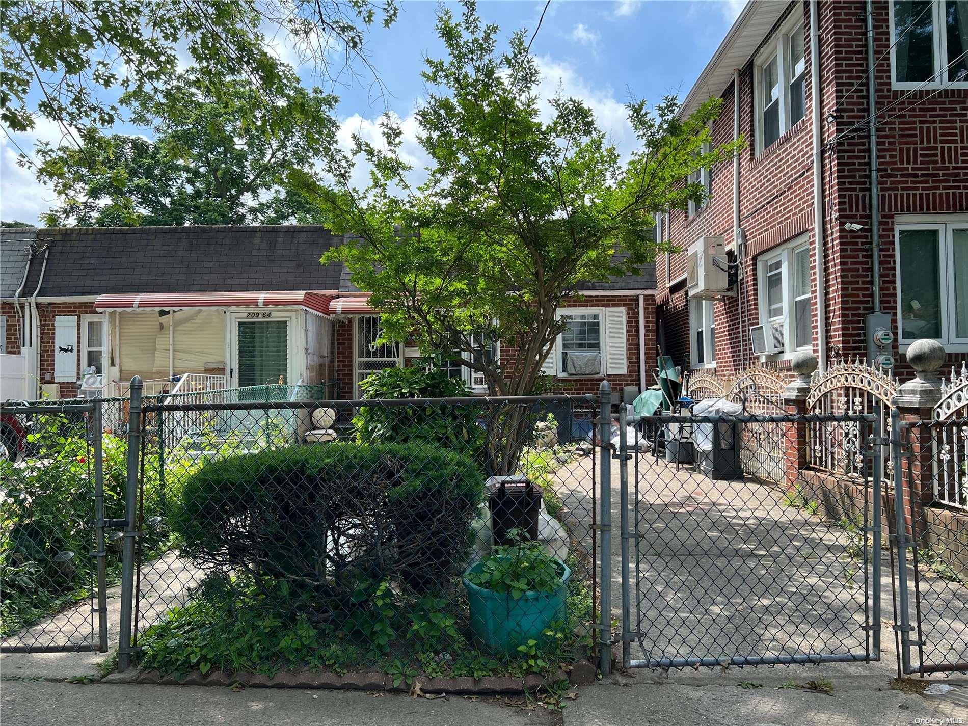 209-62 45th Road Queens, NY 11361 - Photo 1 of 1 a view of a patio with couches table and chairs and potted plants