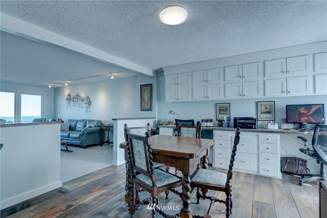 2575 West Beach Road Oak Harbor, WA 98277 - Photo 11 of 25 a view of kitchen with cabinets and wooden floor