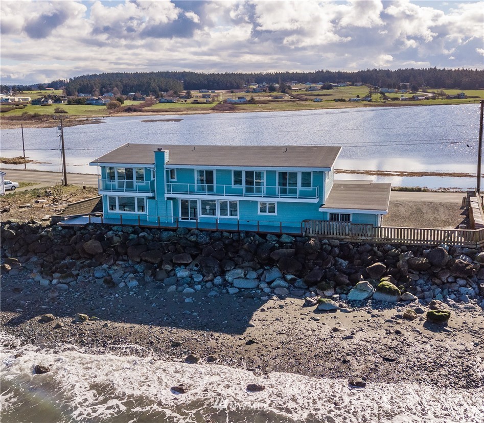 2575 West Beach Road Oak Harbor, WA 98277 - Photo 21 of 25 a front view of a house with a yard