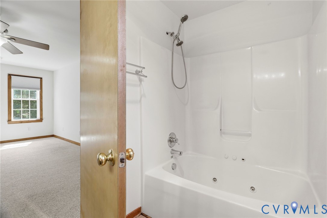 14420 Branding Iron Road Chesterfield, VA 23838 - Photo 26 of 50 White jetted tub and shower combination with chrom