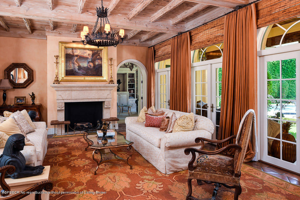 230 Wells Road Palm Beach, FL 33480 - Photo 4 of 9 a living room with furniture a fireplace and a table