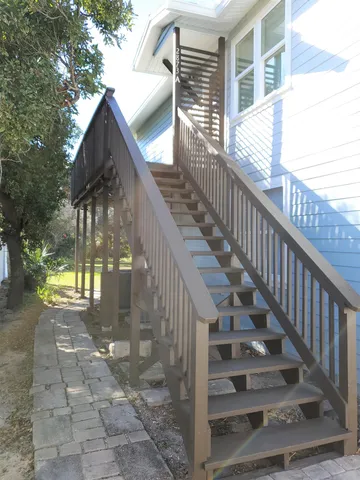 a view of stairs and wooden floor