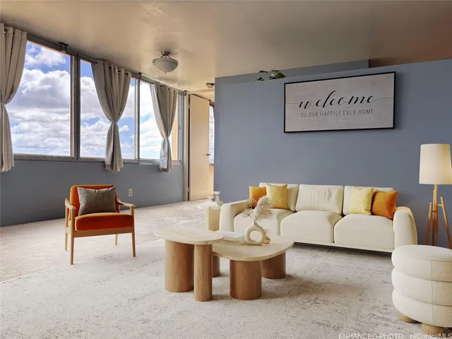 a living room with furniture and a large window