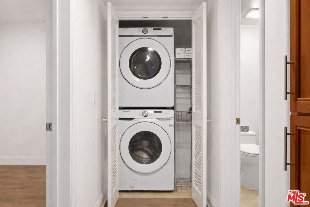 8238 West Manchester Avenue, Unit 108 Playa del Rey, CA 90293 - Photo 6 of 16 a view of a hallway with washer and dryer