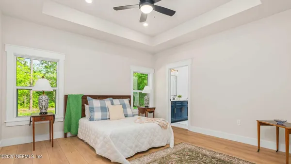 a bedroom with a bed and a table in it