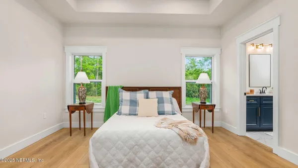 a bedroom with a bed and a table