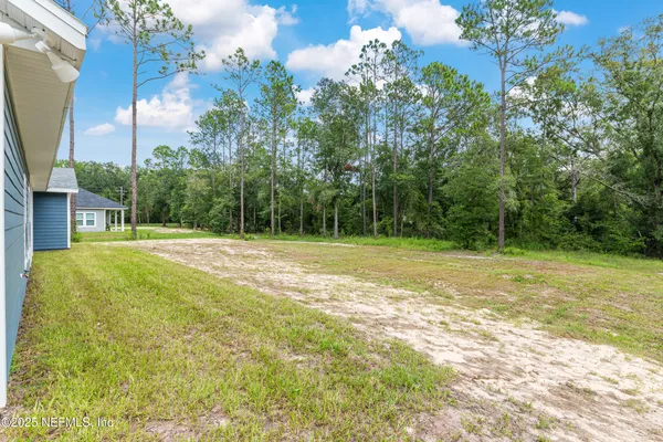 a view of a swimming pool with an outdoor space and seating area