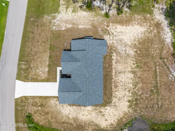 a view of a yard with swimming pool