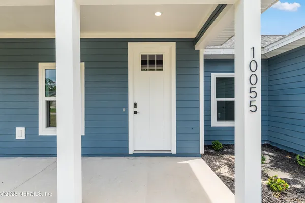 a view of a house with garden and yard