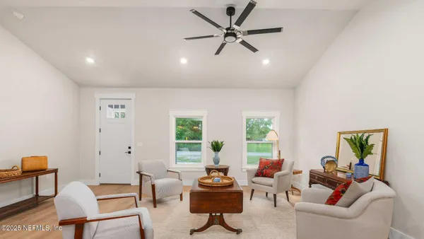 a living room with furniture and a window