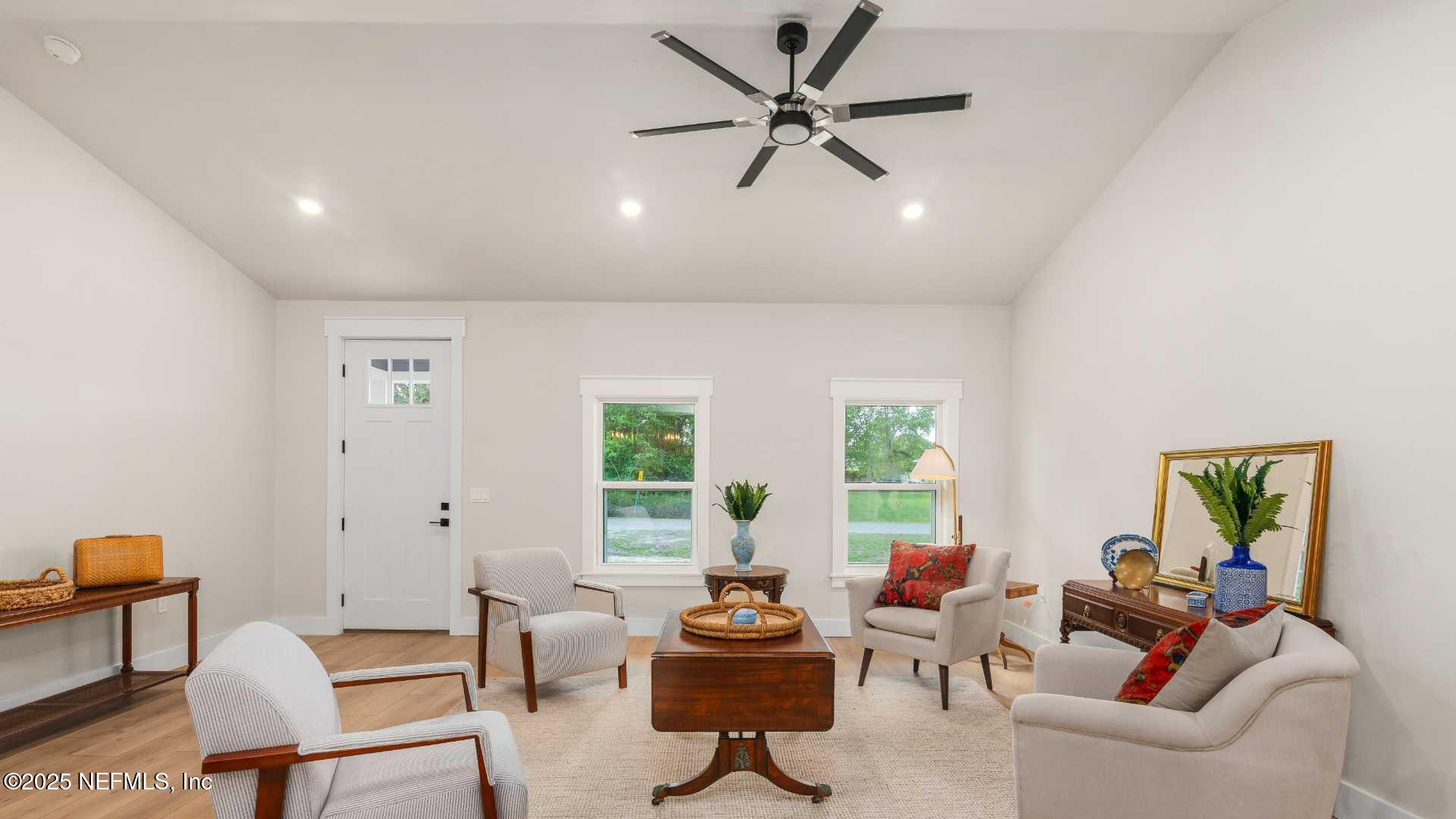 10055 Fox Hollow Drive Hampton, FL 32044 - Photo 8 of 54 a living room with furniture and a large window