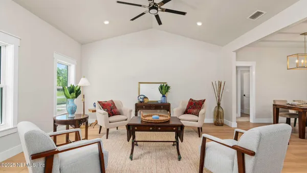 a kitchen with lots of counter top space and dining table